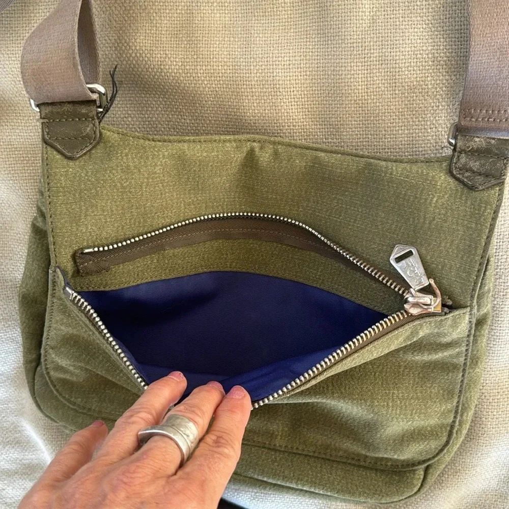 Kipling moss green with colbalt blue lining crossbody bag